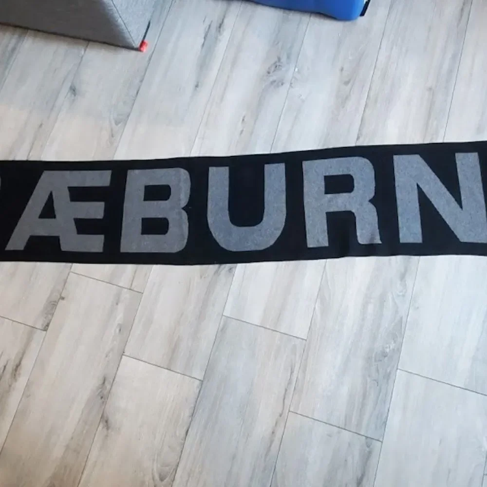 Positively Conscious Raeburn Knitted black cashmere blend Logo Scarf